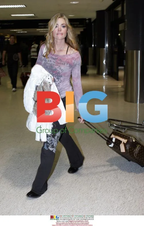 Denise Richards Arrives at LAX