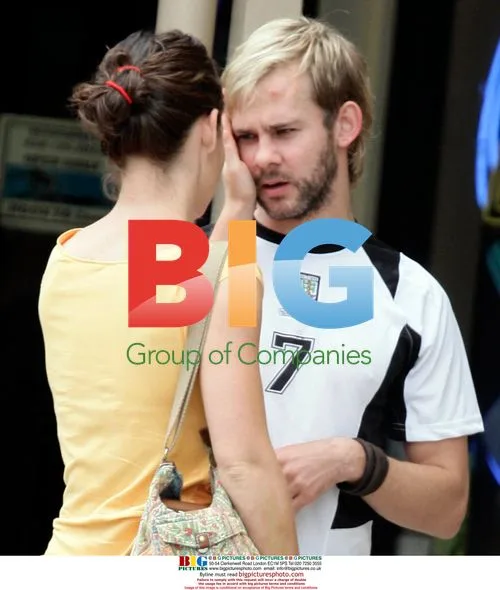 Evangeline Lilly and Dominic Monaghan share a kiss