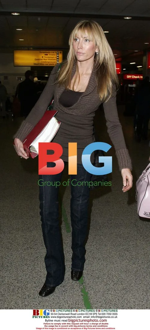 Heather Mills Arrives at Heathrow with Divorce Documents