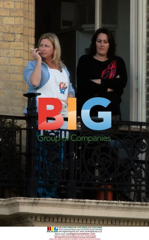 Fiona Mills Appears Dowdy on Balcony at Home