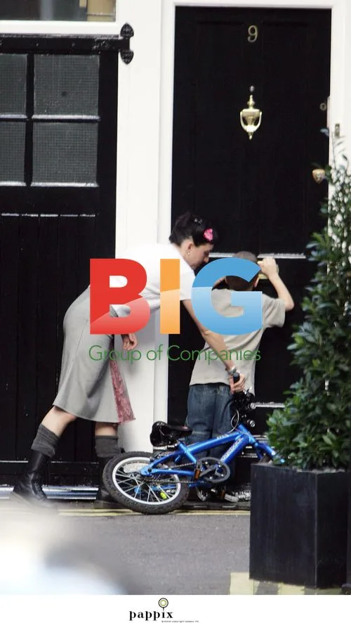 Madonna and Son Rocco Enjoying Bike Ride