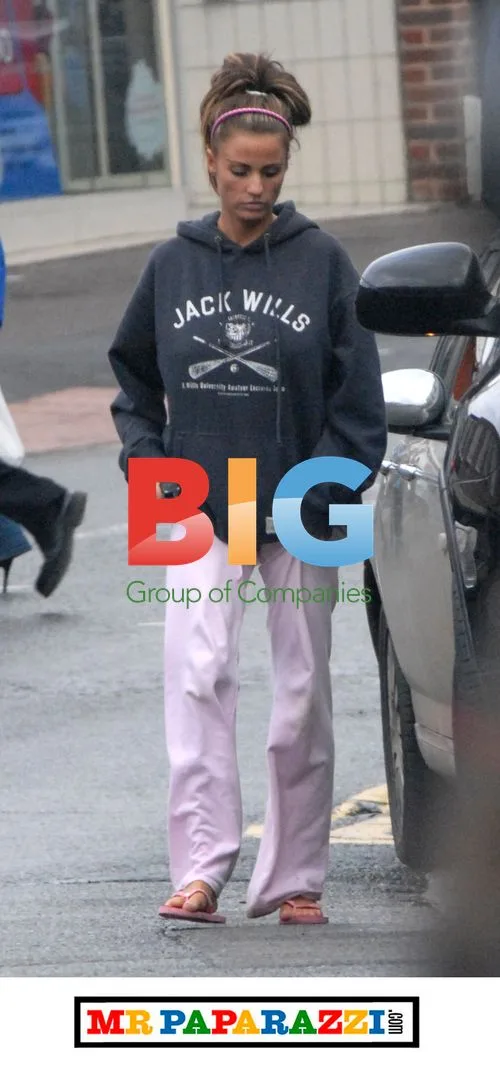 Katie Price Crosses Fingers at Shops