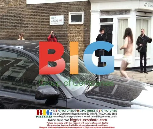 Madonna Leaves Gym, Man in Nappy Runs Up