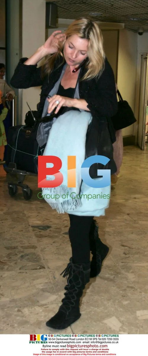 Kate Moss Arrives at Heathrow