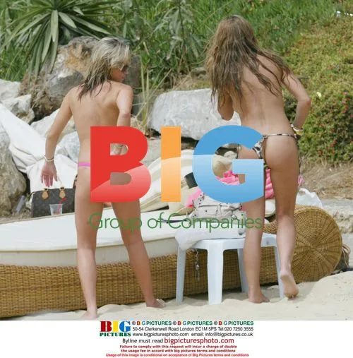 Mrs Robinson bandmates sunbathe topless