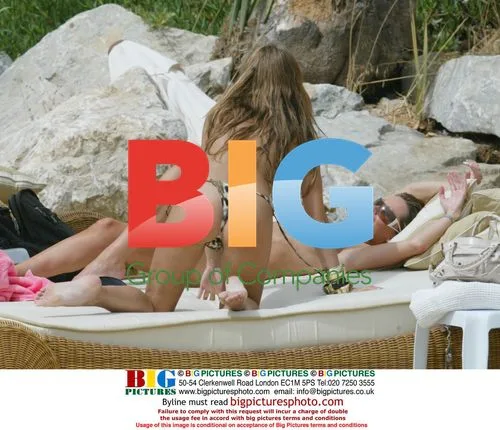 Mrs Robinson Band Members Sunbathe on Beach