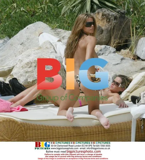 Mrs Robinson band members relax on beach