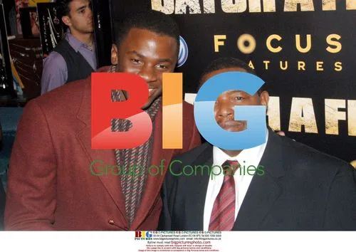 Derek Luke smiles with Patrick Chamusso at 'Catch a Fire' premiere