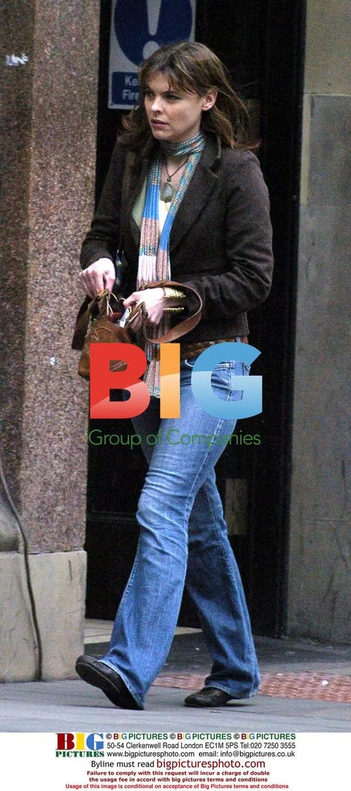Kate Ford Giving to Big Issue Seller