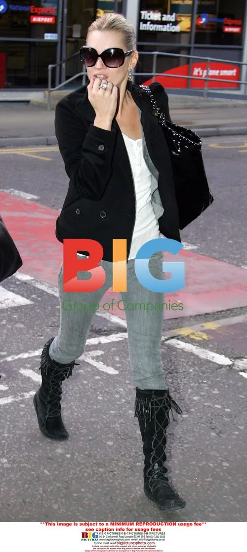 Kate Moss Arrives at Heathrow