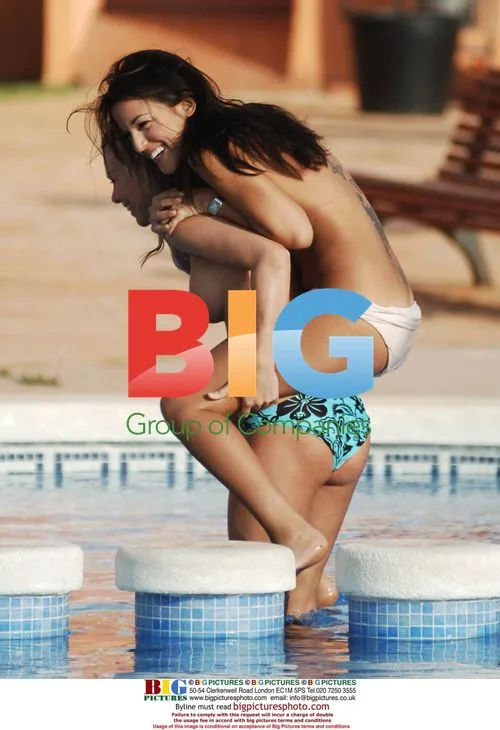 Models Larking Around in Spain Pool
