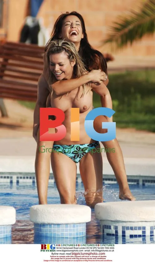 HANNAH JOY LEWIS AND JAKKI DEGG poolside in Spain