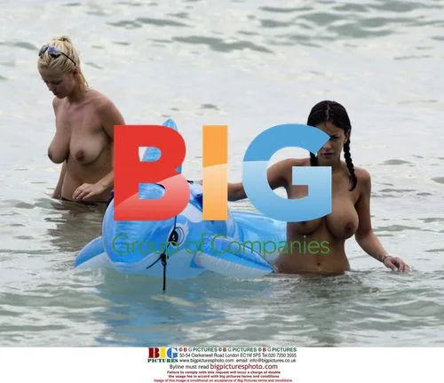 Models Lucy and Malene in Caribbean surf