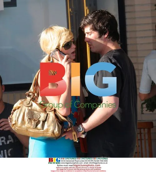 Paris Hilton and Brandon Davis kiss outside Barney's