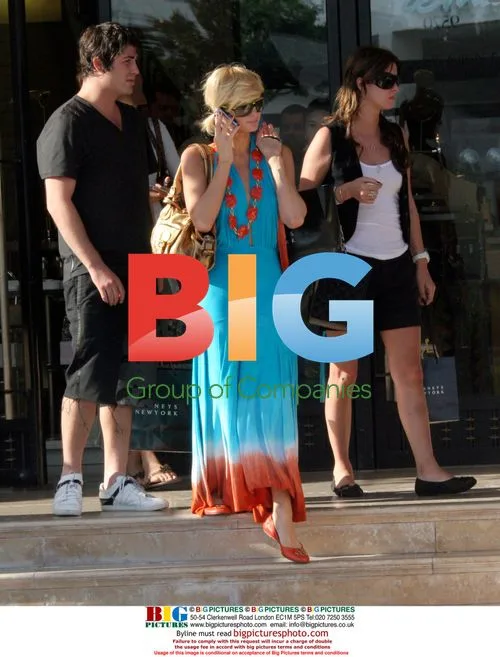 Paris Hilton and Brandon Davis kiss at Barney's
