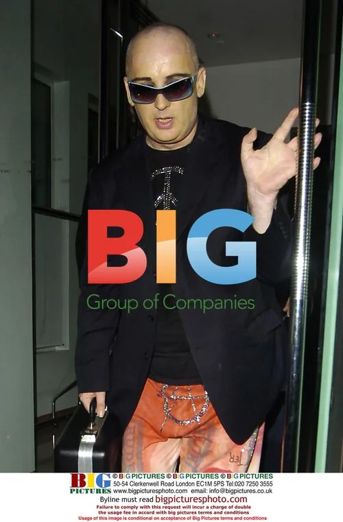Boy George and brother leaving Met Bar, London