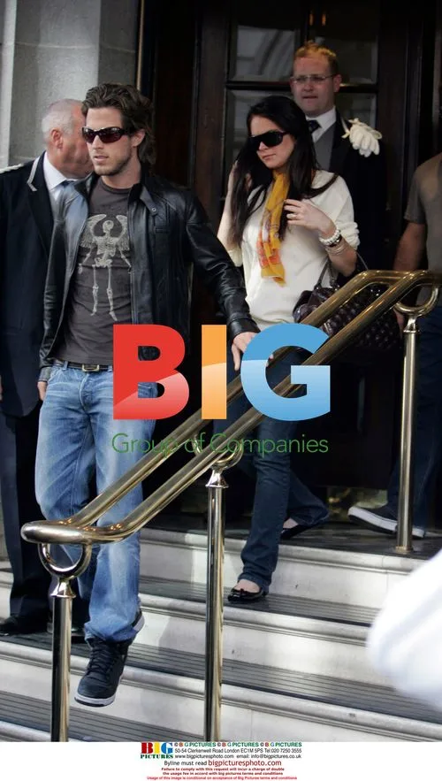Lindsay Lohan leaves Ritz hotel with boyfriend