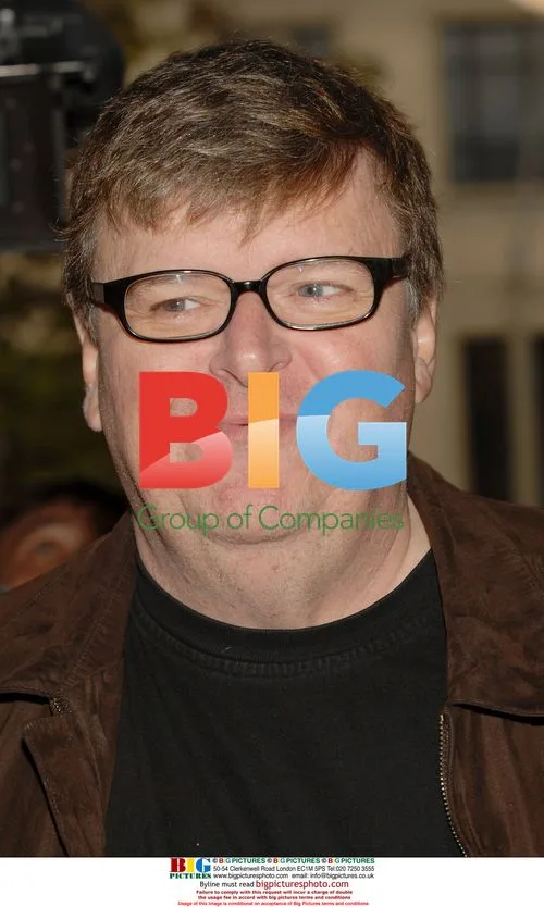 Director Michael Moore arrives for TIFF