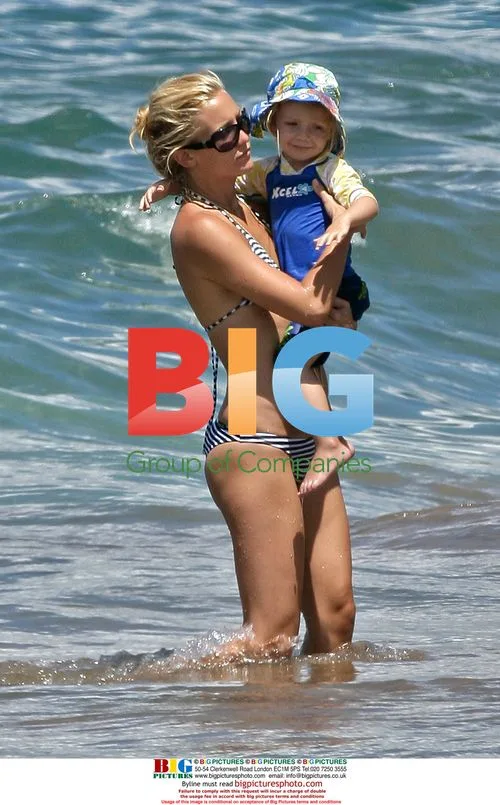 Kate Hudson Surfs With Son Ryder in Hawaii