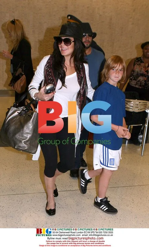 Lindsay Lohan Arrives at JFK with Boyfriend