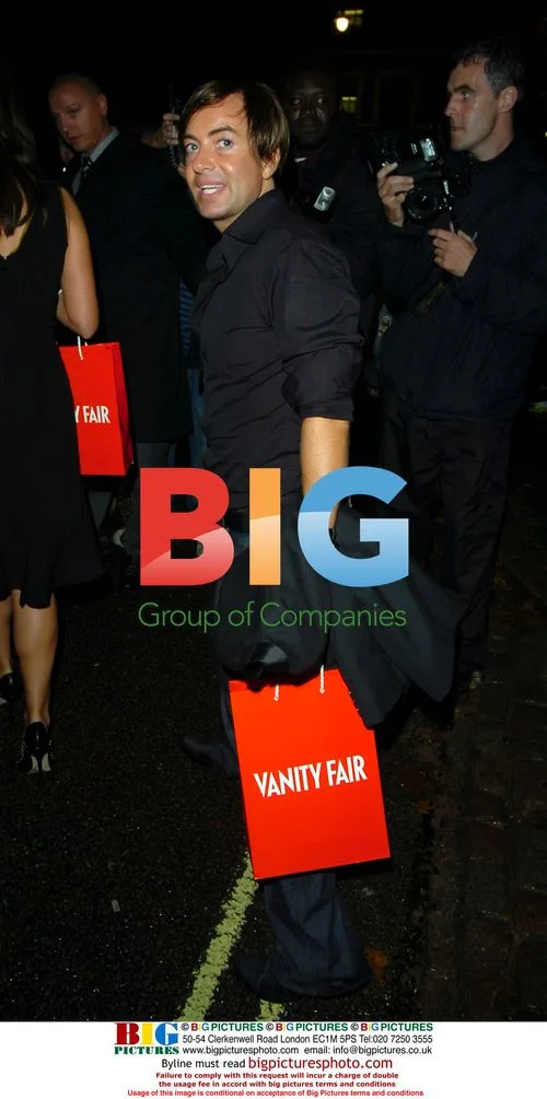 Designer Julian MacDonald leaving London party