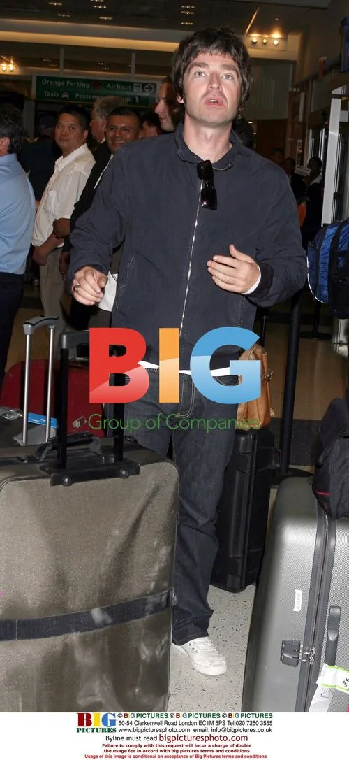 Noel Gallagher and Sara MacDonald at JFK Airport