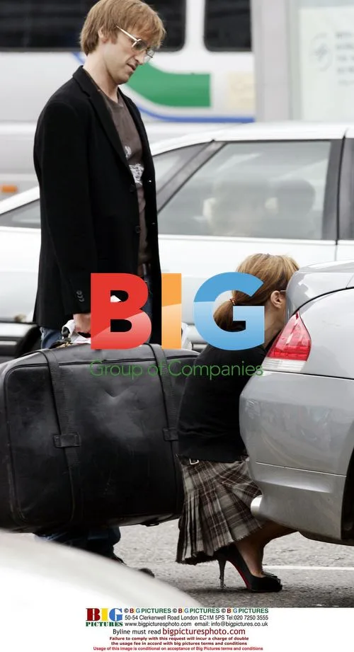 Tara Palmer Tomkinson meets new boyfriend Crispian Belfrage at Heathrow