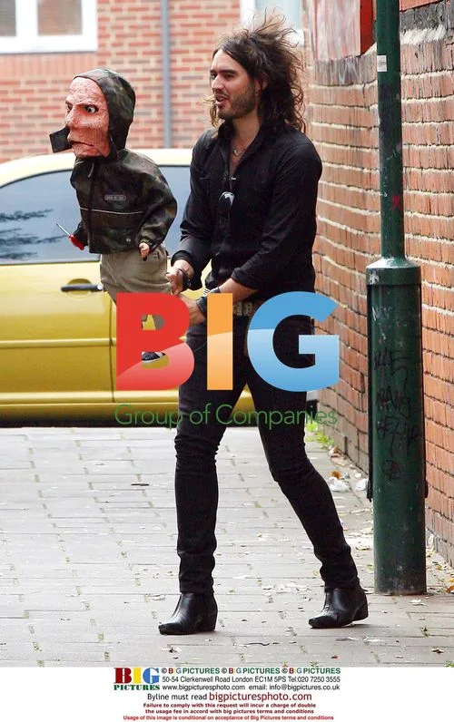 Russell Brand Plays with Puppet on TV Show Filming