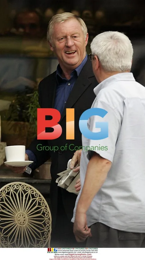Chris Tarrant drinks coffee, chats on phone in London