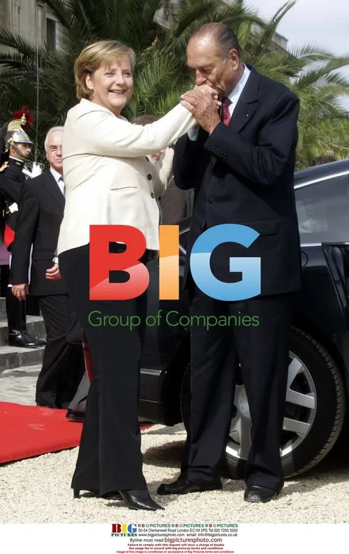 Chirac Kisses Merkel's Hand