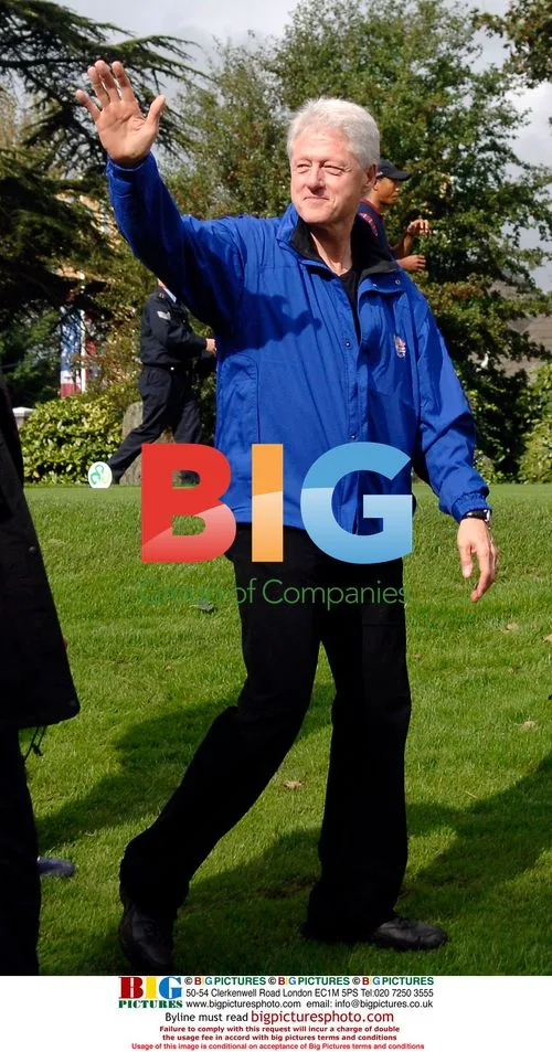 Bill Clinton waves at 2006 Ryder Cup