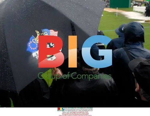 Spectators at Ryder Cup in heavy rain