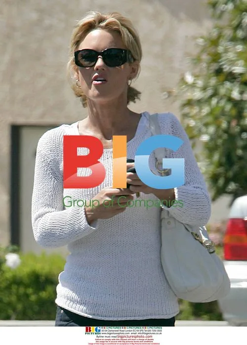 Kelly Carlson Texting in Malibu