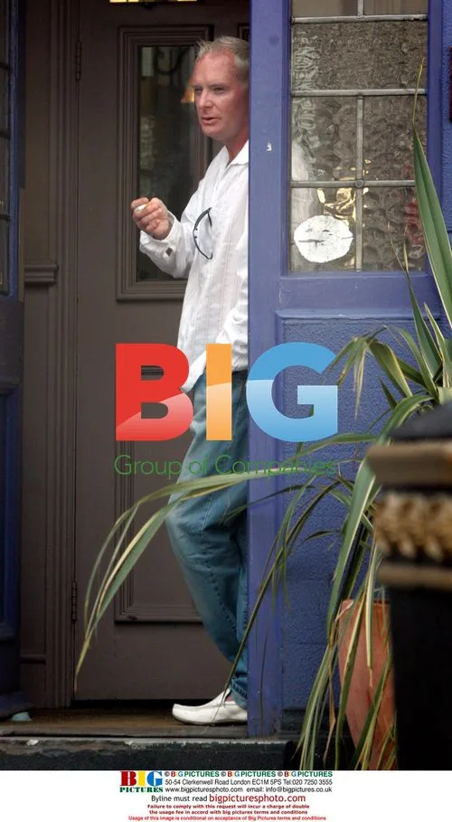Football legend Paul Gascoigne smoking outside pub