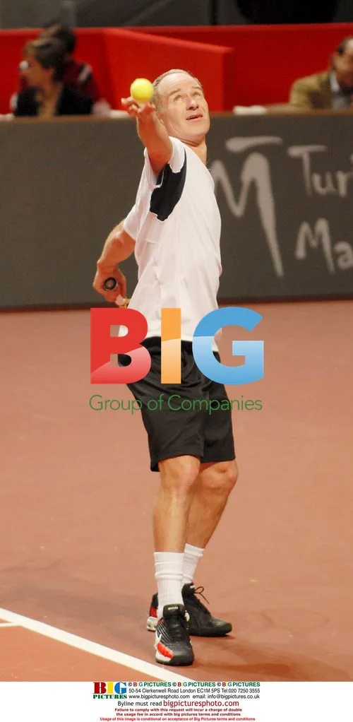 Albert Costa defeats John McEnroe