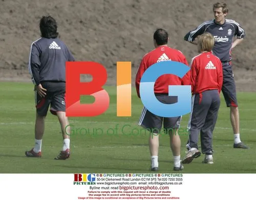 Liverpool Boss Rafa Benitez Attends to Injured Player
