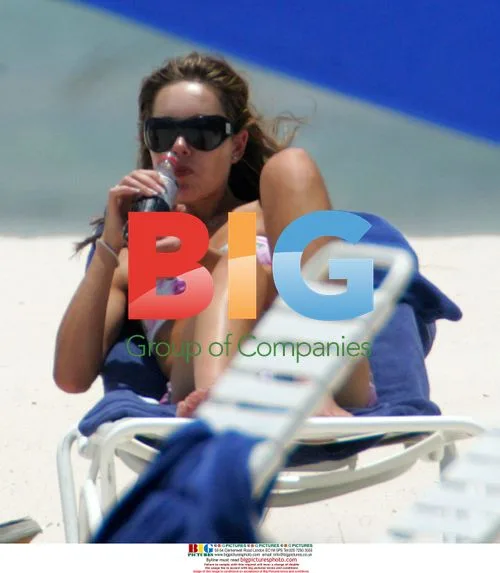 Rachael Flintoff Sunbathes on Caribbean Beach