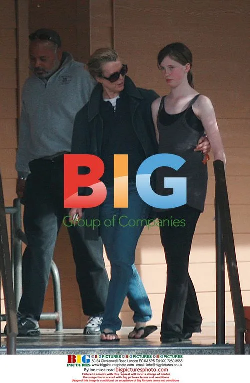 Kim Basinger and daughter out with bodyguard