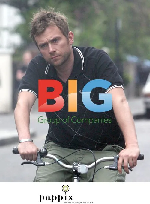 Damon Albarn out on bike in bright pink pants