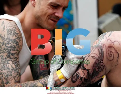 Festival Attendee Shows Tattoo