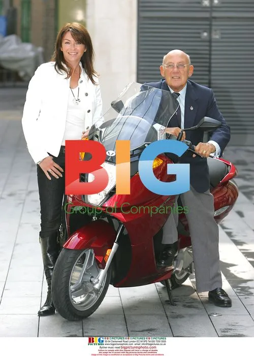 Suzy Perry and Sir Stirling Moss at electric scooter launch