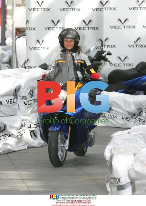 Suzy Perry and Sir Stirling Moss at Vectrix scooter launch