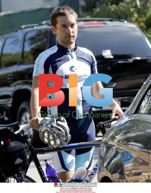 Tobey Maguire rides bike in Brentwood