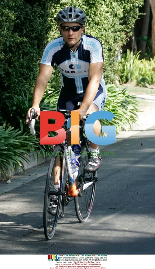 Tobey Maguire rides bike in California