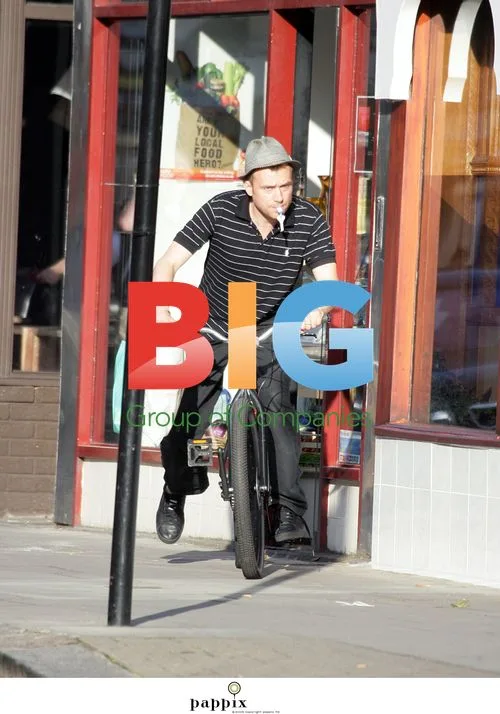 Damon Albarn Riding Bike in London