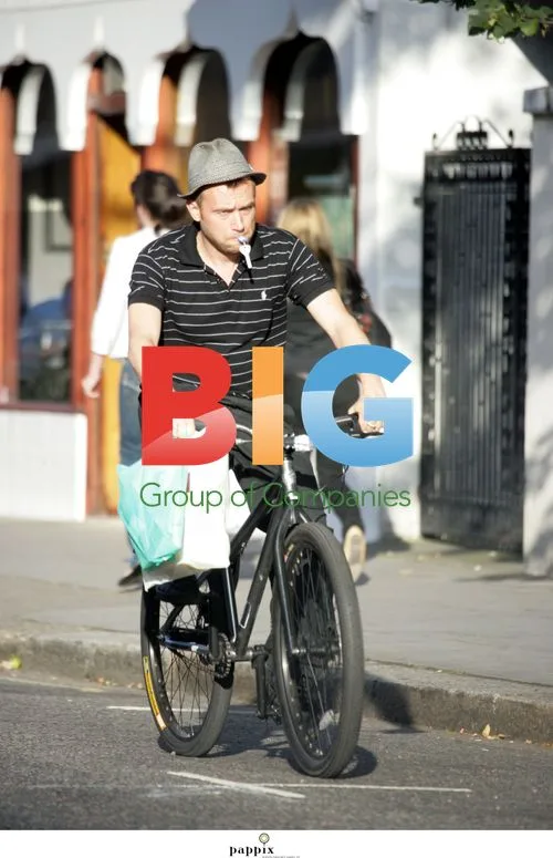 Damon Albarn Rides Bike with Keys in Mouth