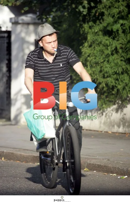 Damon Albarn Biking to Shops in London