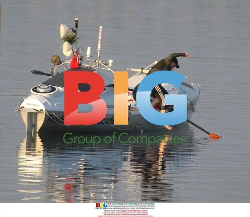 Roz Savage jumps from grounded rowboat