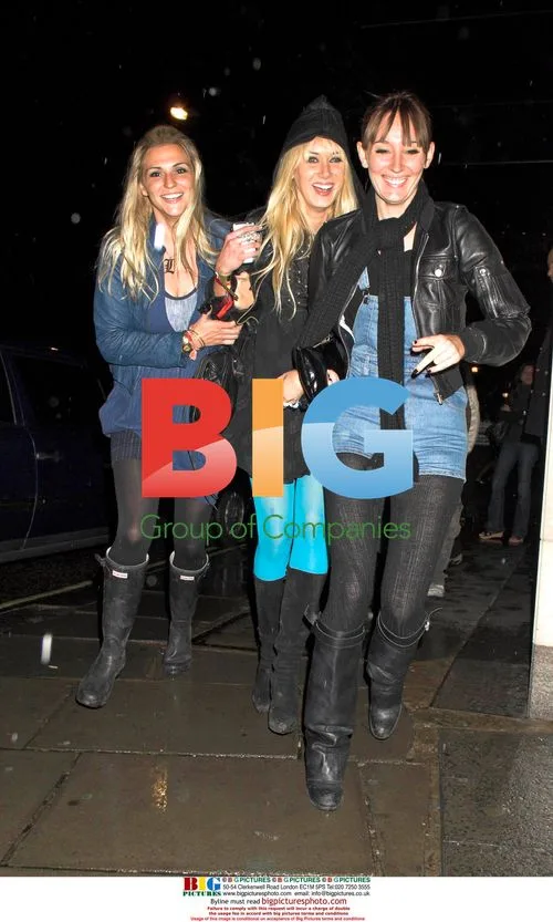 Kimberly and Ruby Stewart dash through rain