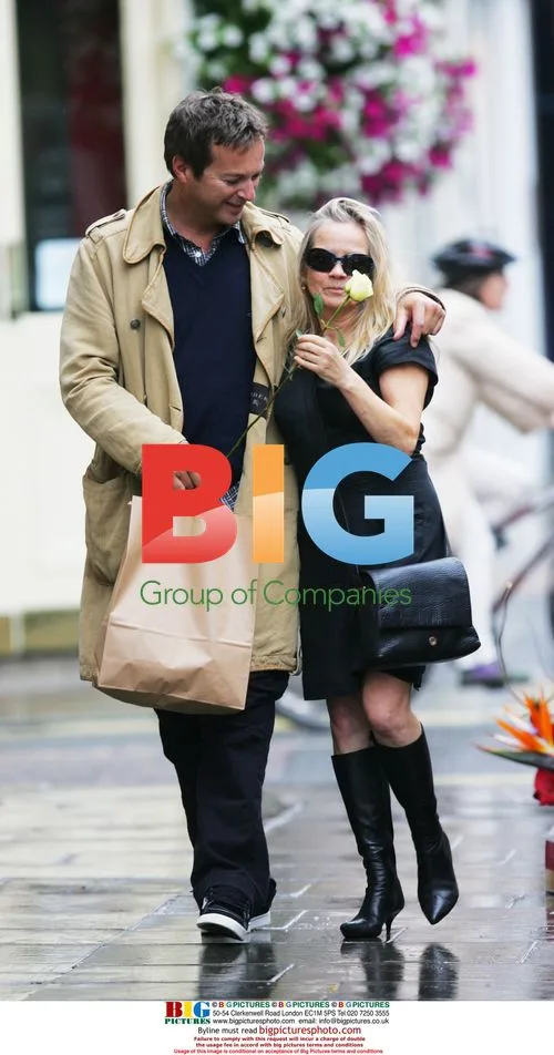 Julian Clary and Jo Good strolling in London